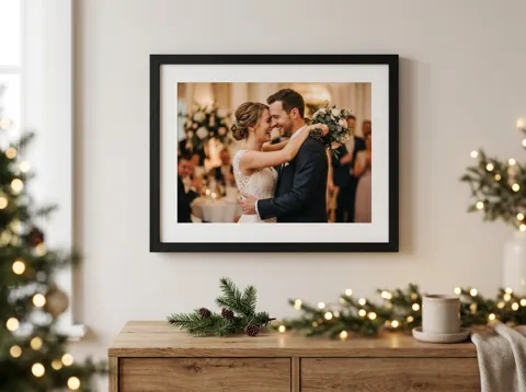 A couple’s photo in a black frame on a sideboard