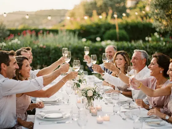 A photo book page: the toast at the table with the guests