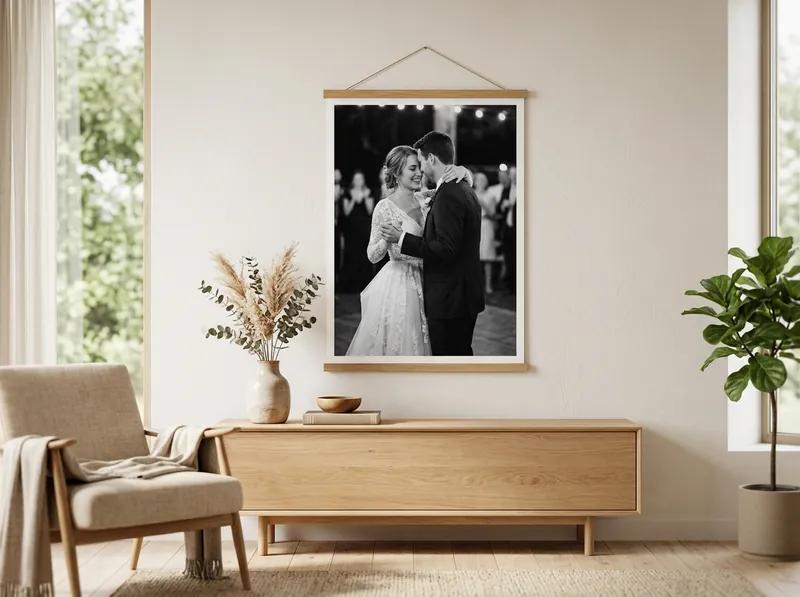A black and white poster of the couple hanging in a living room